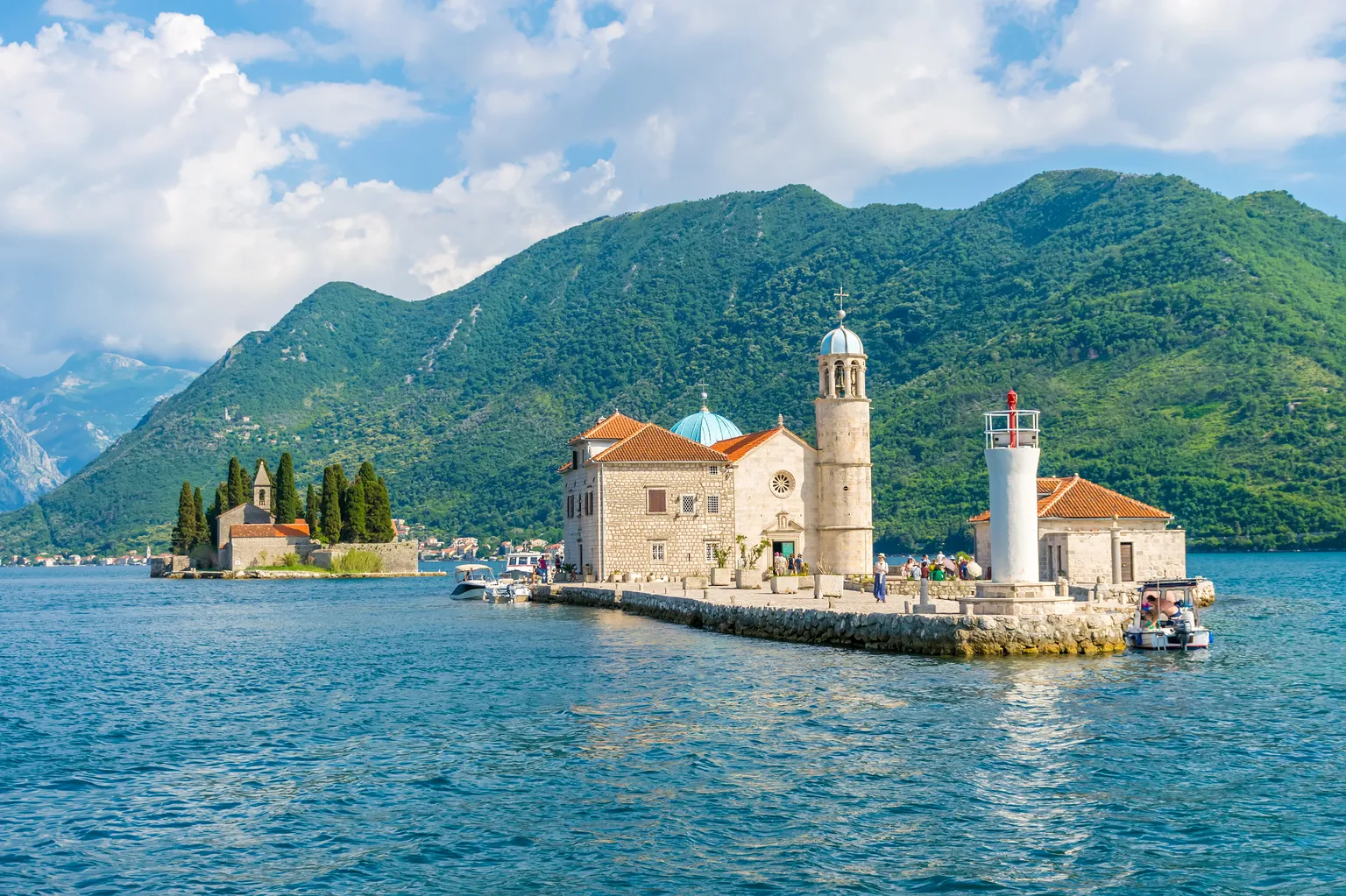 Montenegro - MONTENEGRO - JUNE 04:2017. Tourists sailed on a yacht to the island of Gospa od Skrpela in the Boka Bay of Kotor. - AdobeStock_170364000